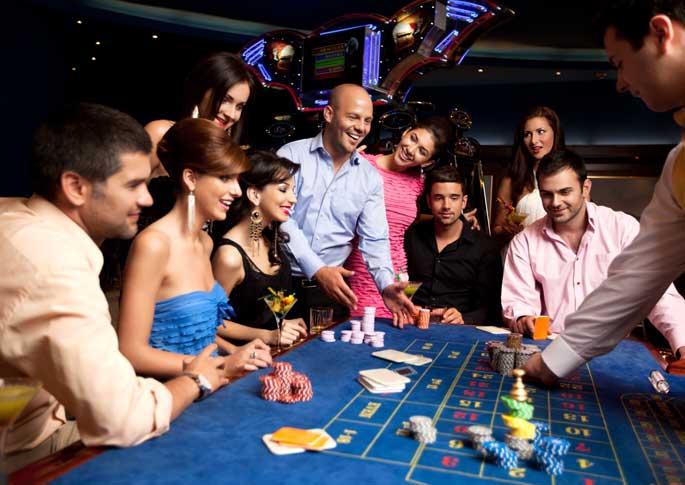 Group Having Fun Playing Roulette During Casino Party Rental